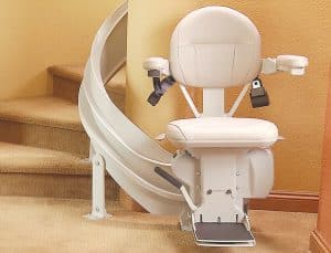 curved stair lift parked bottom of staircase