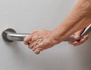 elderly hand grabbing a residential bar