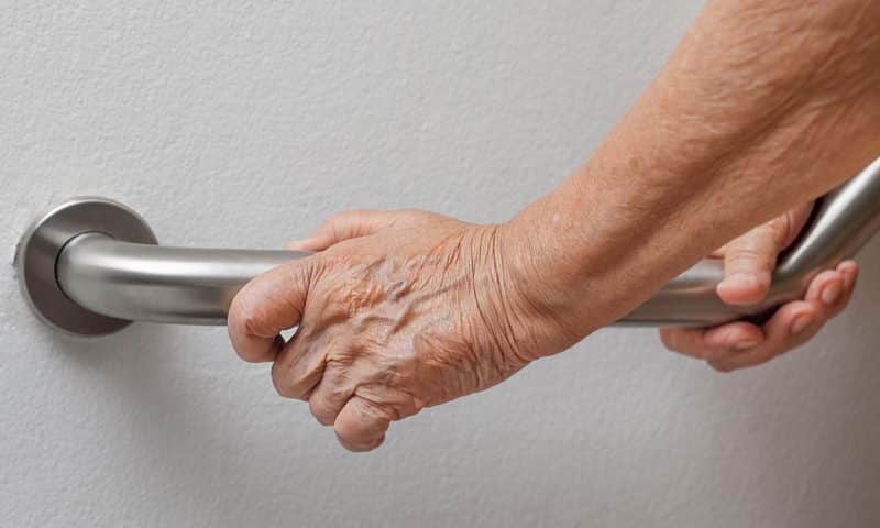 elderly hand grabbing a residential bar