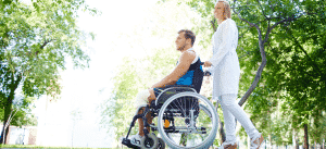 couple at park with man on wheelchair