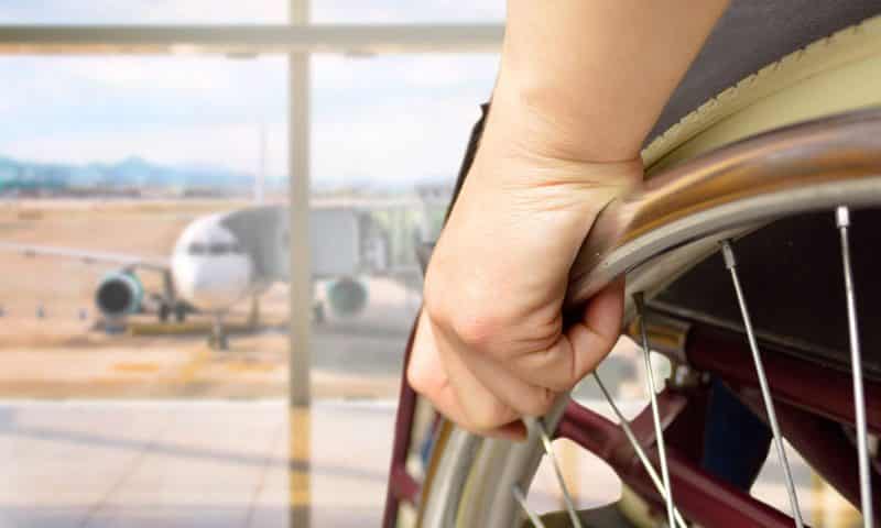 person in wheelchair at airport