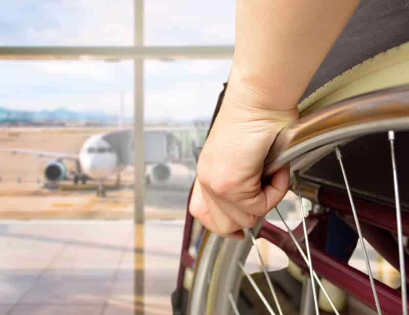 person in wheelchair at airport